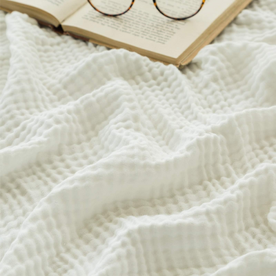 CozyHaven™ – Atmungsaktive Musselin-Decke