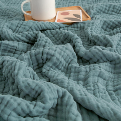 CozyHaven™ – Atmungsaktive Musselin-Decke