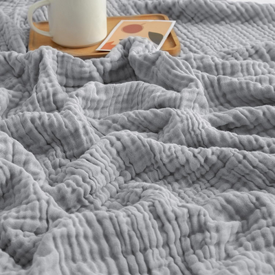CozyHaven™ – Atmungsaktive Musselin-Decke