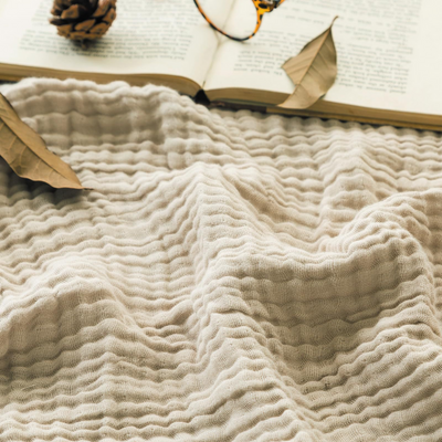 CozyHaven™ – Atmungsaktive Musselin-Decke