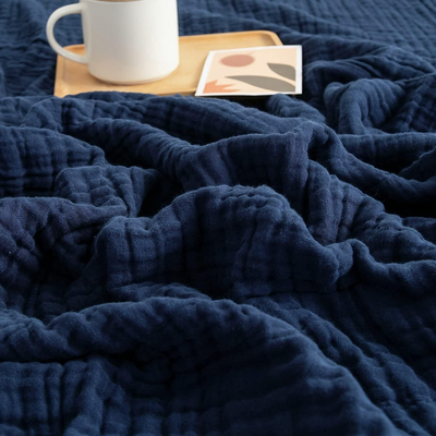 CozyHaven™ – Atmungsaktive Musselin-Decke